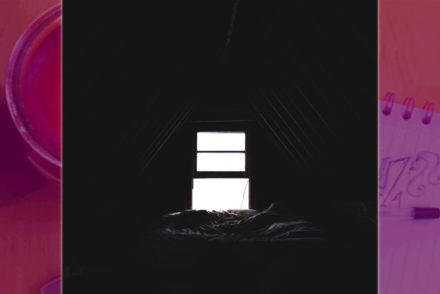 dark room in silhouette with bright white window