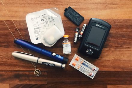 Defunct insulin pump, insulin and insulin injections on a table