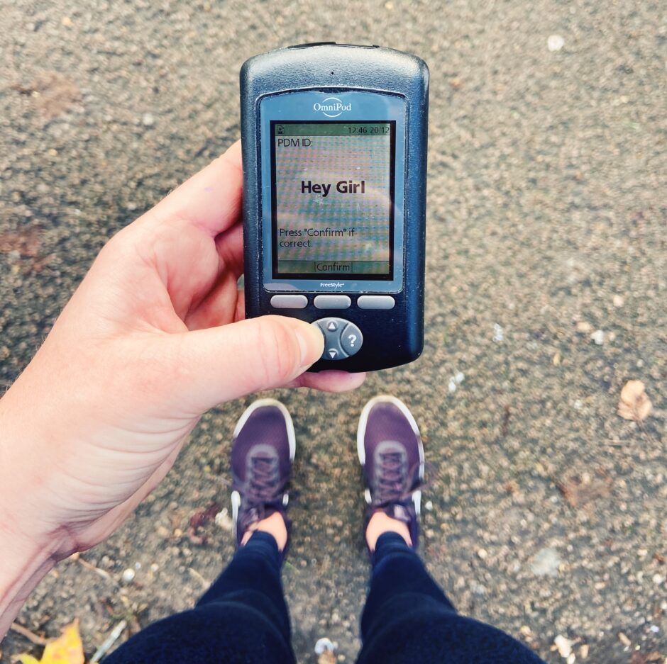 An Omnipod PDM being held by a runner